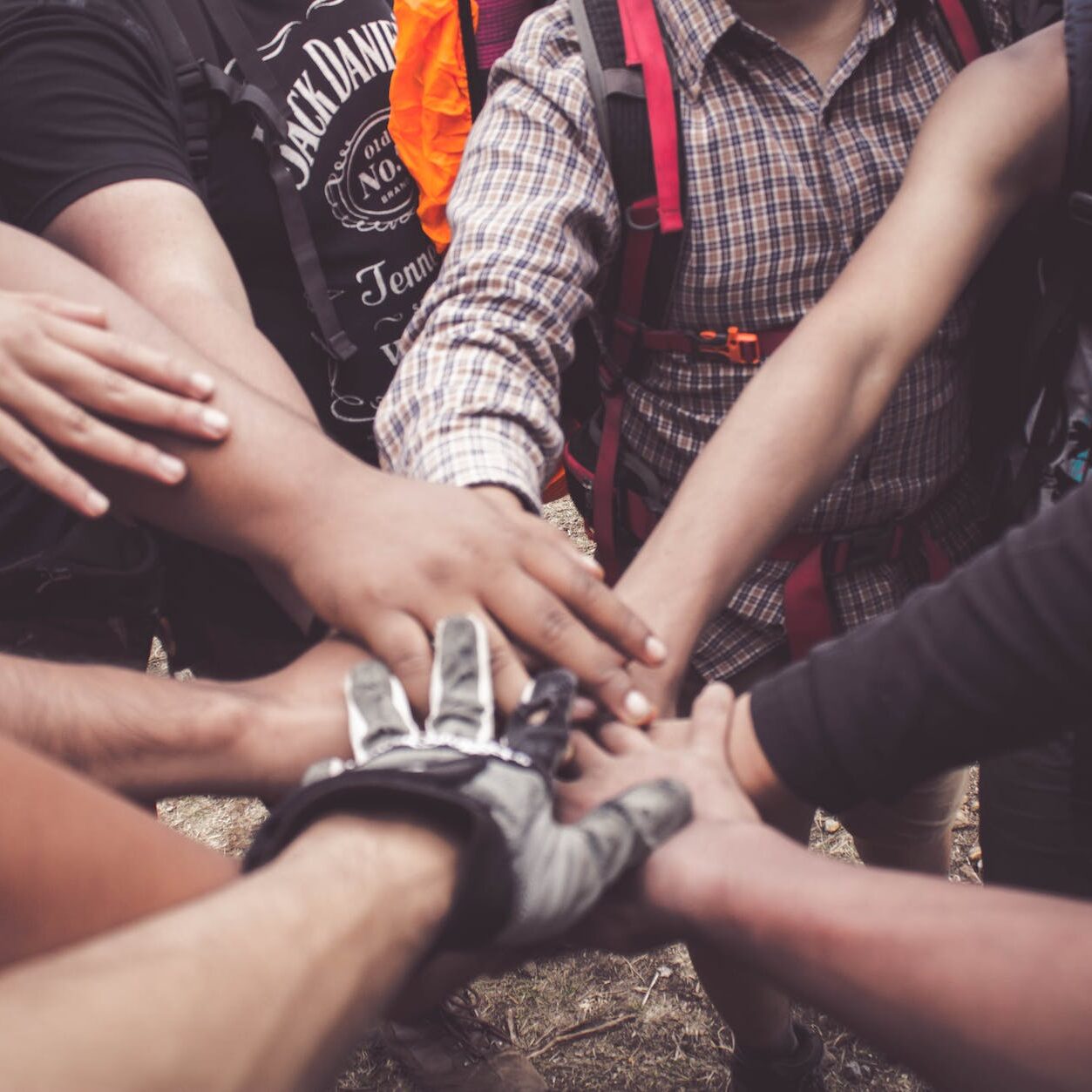 people doing group hand cheer